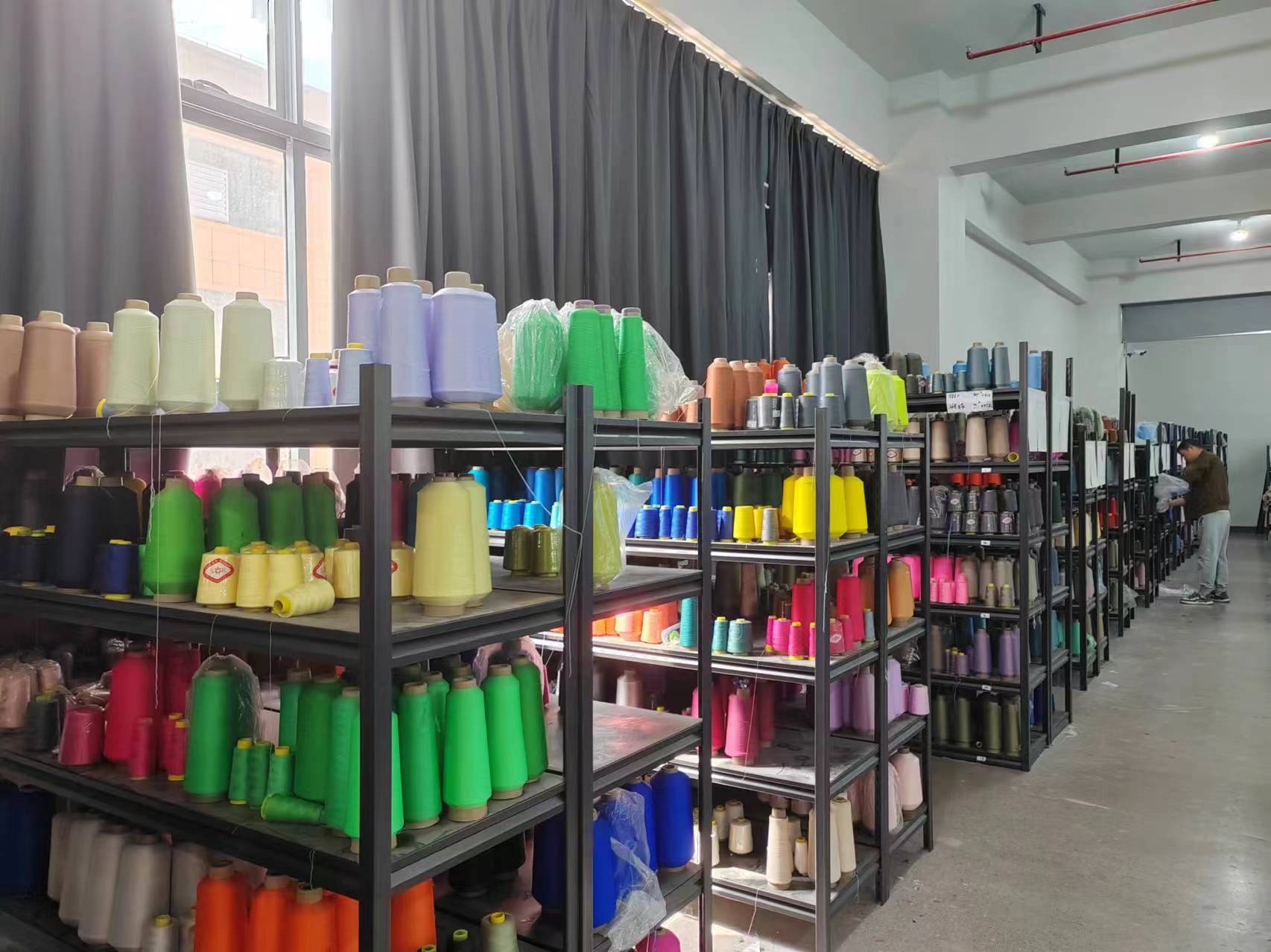 Colourful thread cones organised in the factory